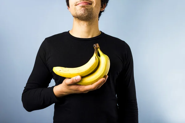 Man met bananen — Stockfoto