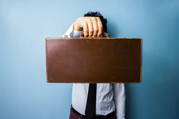 Businessman presenting a briefcase of importance — Stock Photo, Image