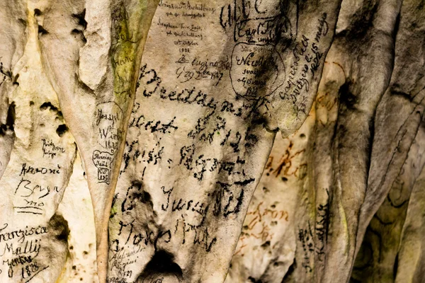 19th century graffiti on cave wall — Stock Photo, Image