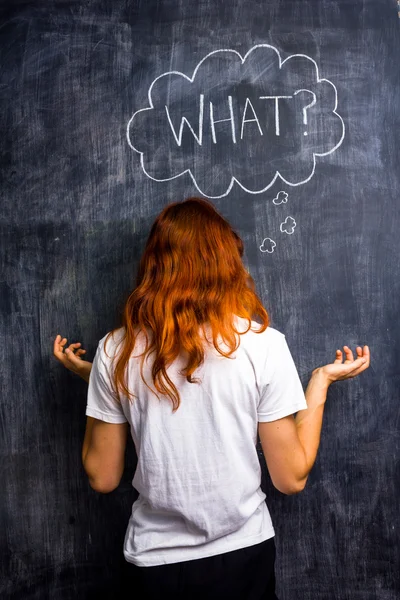 Redhead woman asking what — Stock Photo, Image
