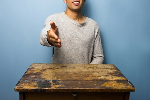 Young man offering handshake — Stock Photo, Image