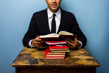 Young law student reading books clipart