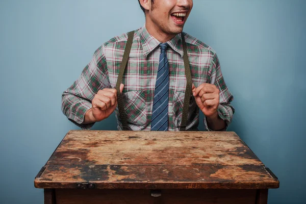 Young geek man showing off his braces — Stock Photo, Image