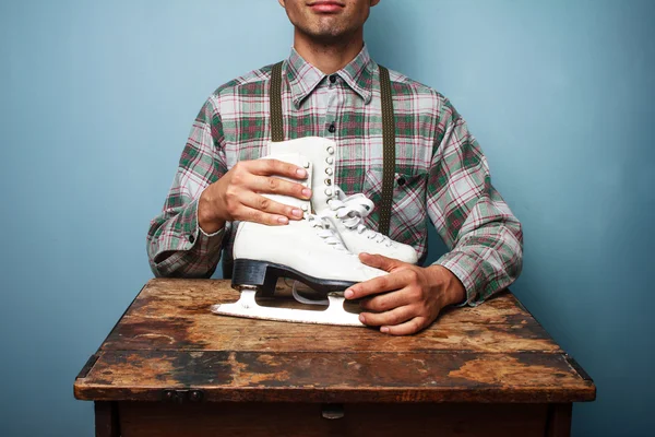 Park ranger with ice skates — Stock Photo, Image