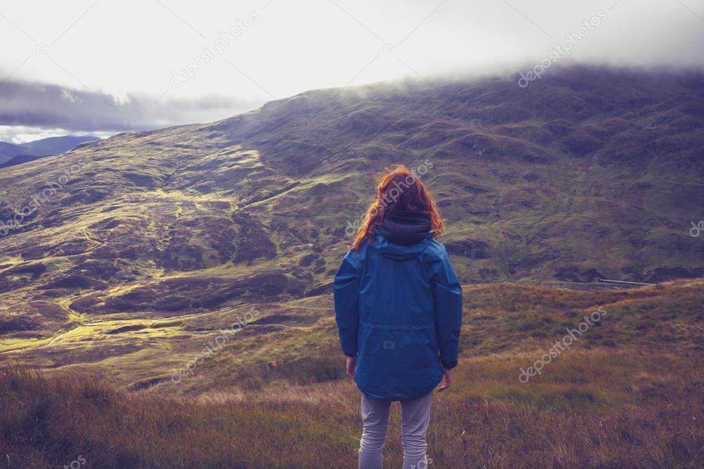 Woman admiring view from mountain top