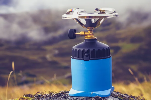 Camping stove on a rock in the mountains — Stock Photo, Image