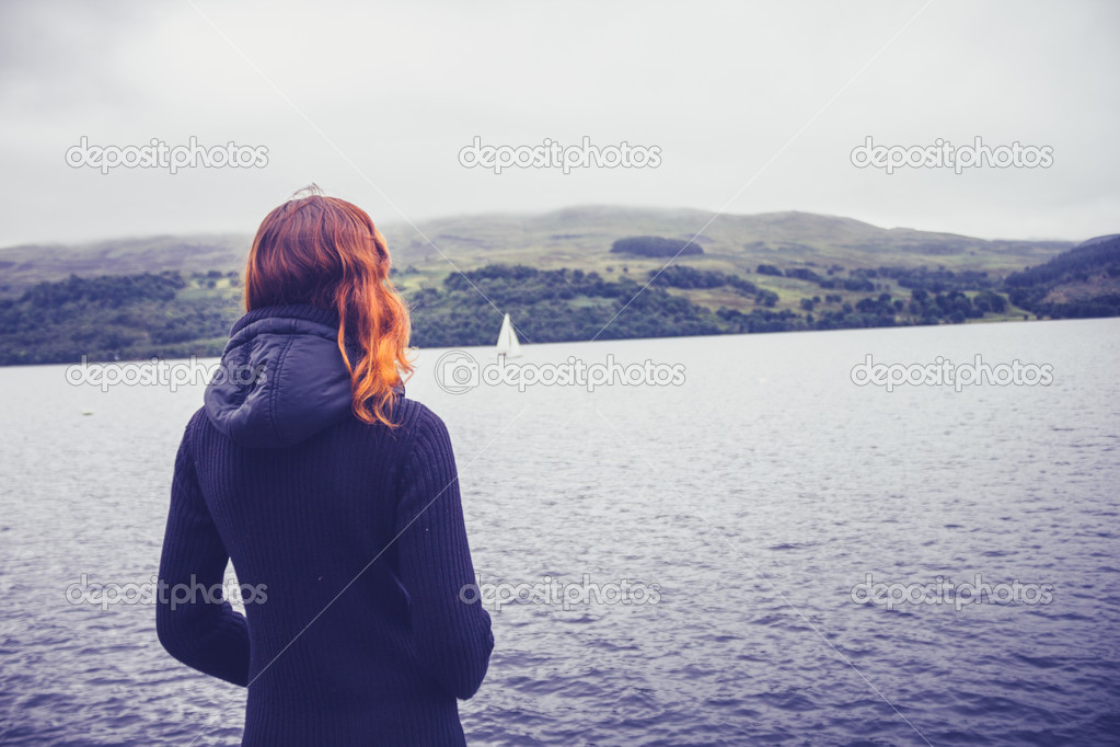 Woman admiring stillness of the lake