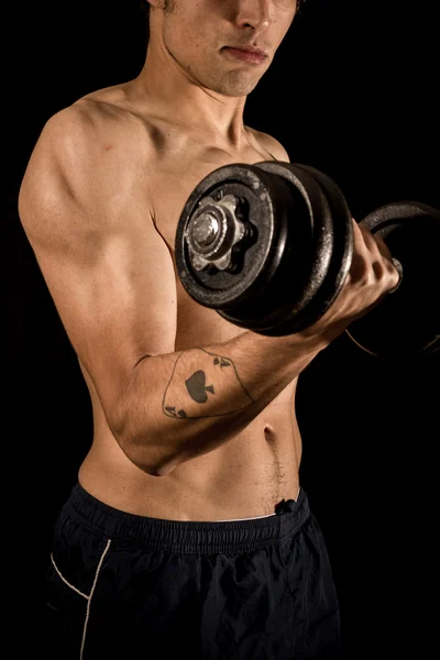 Young athletic bodybuilder exercising — Stock Photo, Image