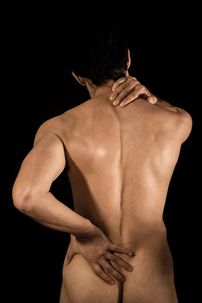 Young man naked with back and neck pain — Stock Photo, Image