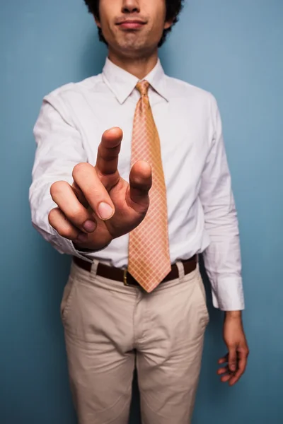 Young man in shirt and tie pushing button — Stock Photo, Image