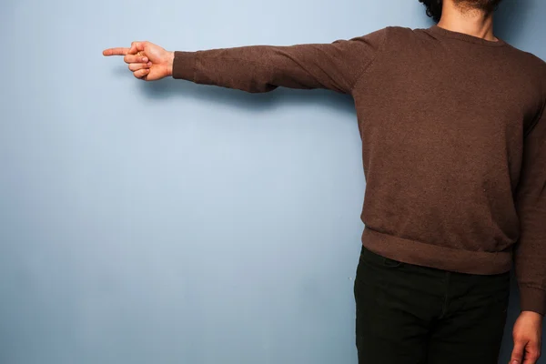 Young man is pointing — Stock Photo, Image