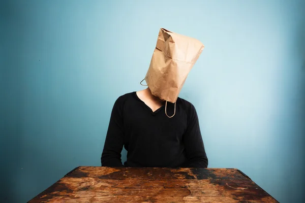 Sad man with bag over head — Stock Photo, Image