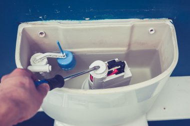 Hand fixing toilet clipart