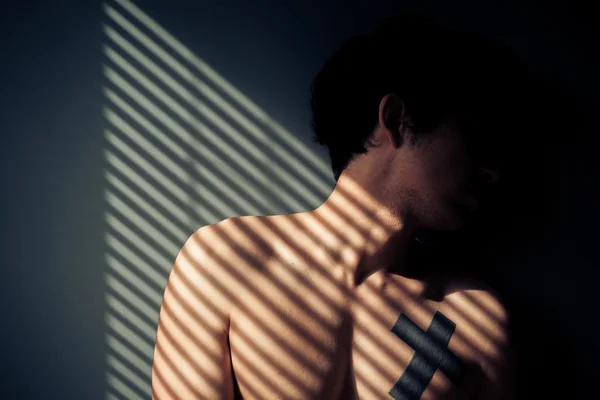 Sad man sitting by window — Stock Photo, Image