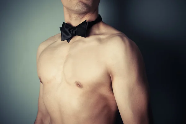 Young shirtless man with bow tie — Stock Photo, Image