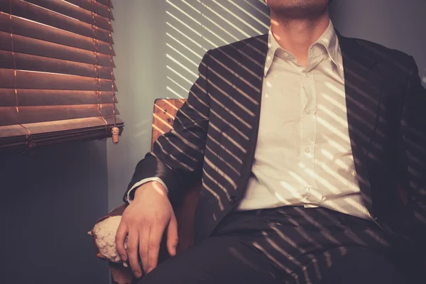 Young man relaxing on sofa — Stock Photo, Image