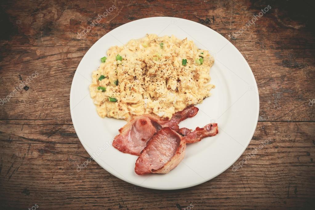 Bacon and scrambled eggs Stock Photo by ©lofilolo 44256909