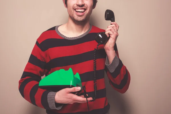 Happy young man on the telephone — Stock Photo, Image