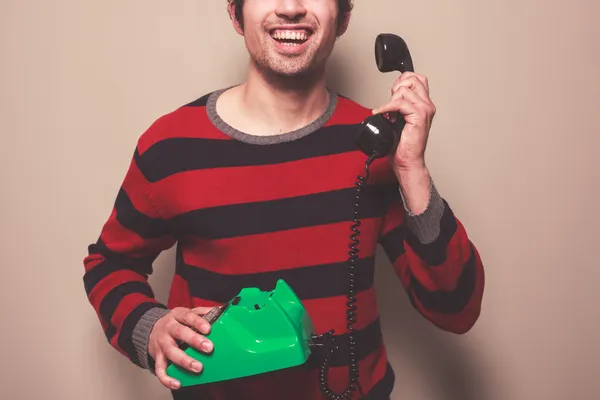 Happy young man on the telephone — Stock Photo, Image