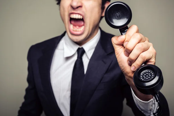 Angry businessman on the phone — Stock Photo, Image