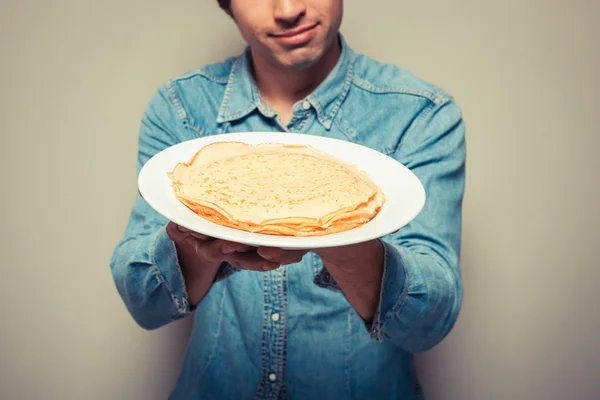 Man with stack of pancakes — Stock Photo, Image