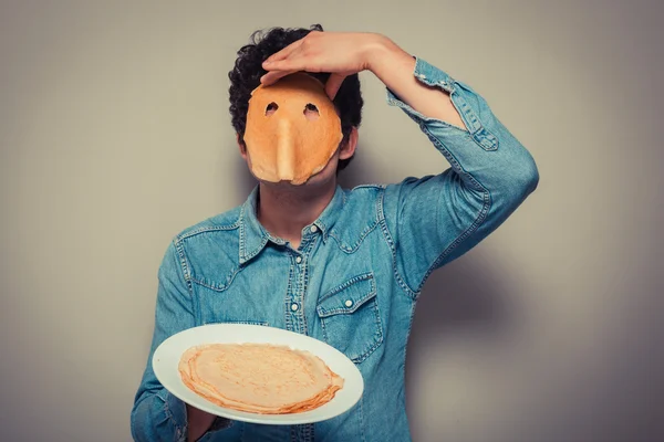Man with pancake on his face — Stock Fotó