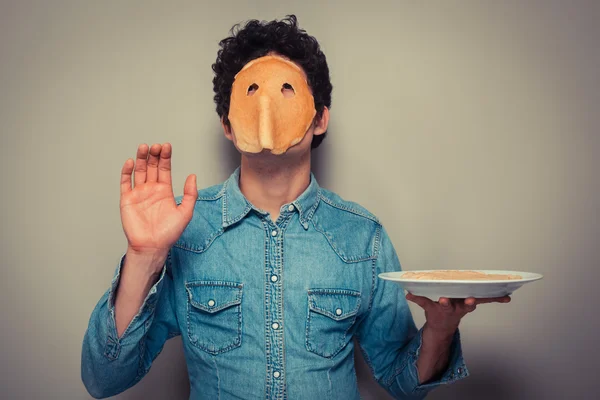 Man met pannenkoek op zijn gezicht — Stockfoto