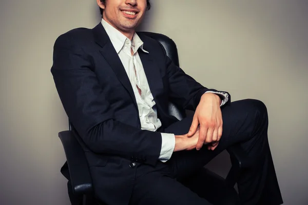 Happy young businessman in relaxed pose — Stock Photo, Image