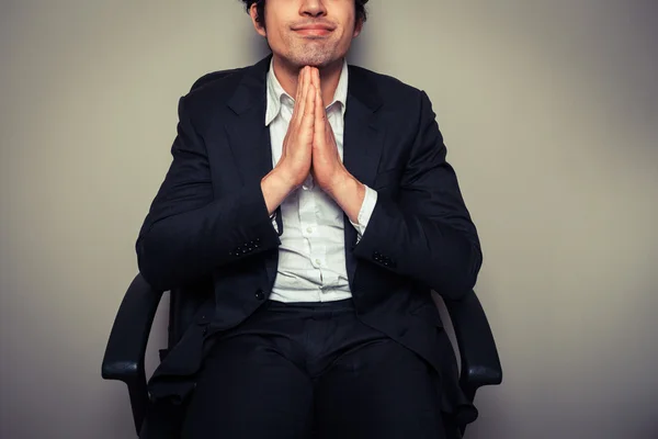 Businessman sitting in office chair — Stock Photo, Image