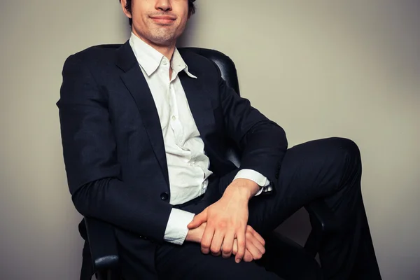 Happy young businessman in relaxed pose — Stock Photo, Image