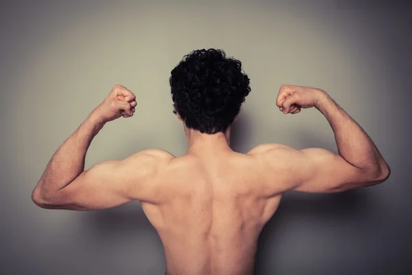 Rear view of athletic young man — Stock Photo, Image