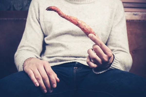 Man with rotten carrot — Stock Photo, Image