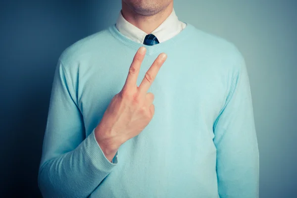 Muž zobrazování neslušné gesto — Stockfoto