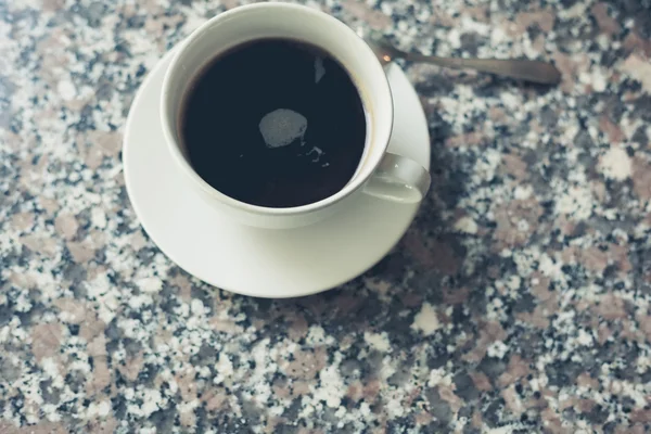 Cup of coffee on a table — Stock Photo, Image