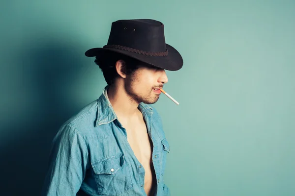 Cowboy smoking a cigarette — Stock Photo, Image