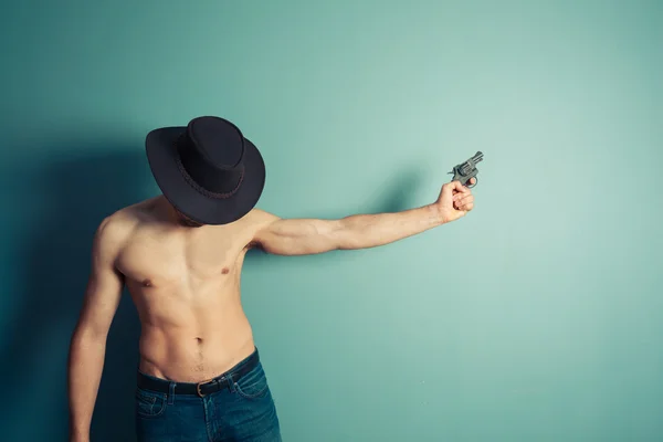 Shirtless cowboy with a gun — Stock Photo, Image