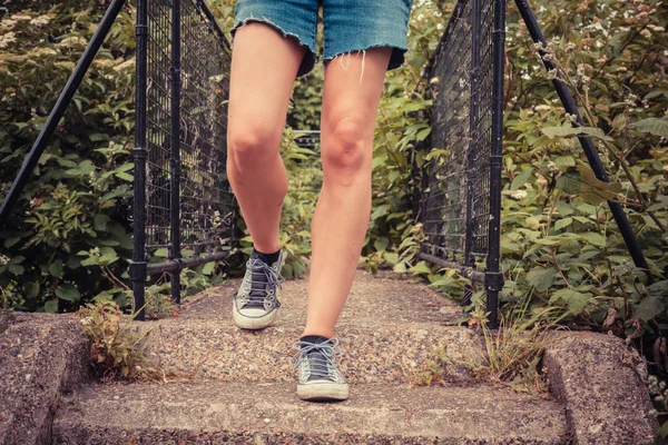 The legs of a young woman outside in nature — Stock Photo, Image