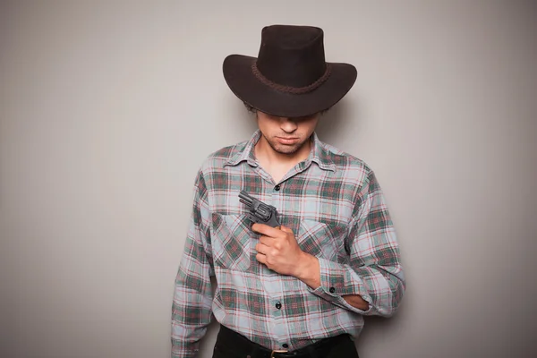 Fiatal cowboy fegyverrel — Stock Fotó