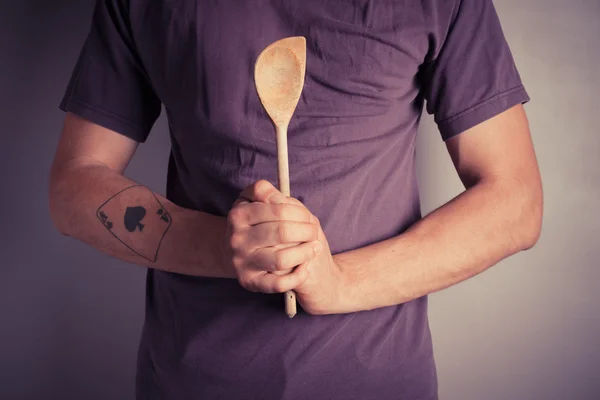 Man holding spoon — Stock Photo, Image