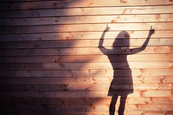 A sombra de uma jovem mulher — Fotografia de Stock