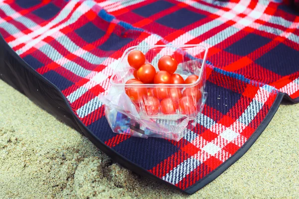 Tomatoes on a blanket — Stock Photo, Image