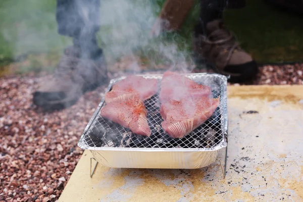 Tuna steaks on a barbecue — Stock Photo, Image