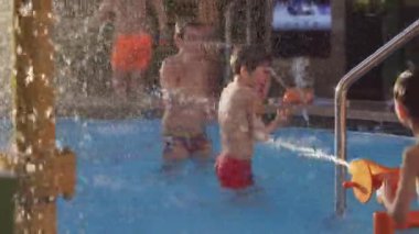 4k, children play in the water park pool on the upper deck of a cruise ship MSC Seaview