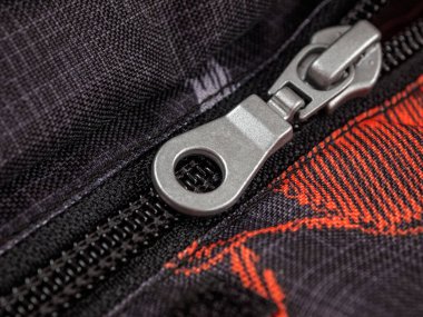Zipper lock, macro, selective focus, slider device and plastic teeth links clipart