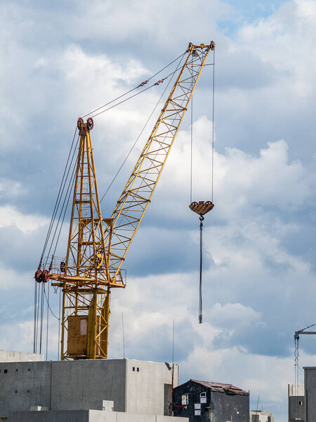 Tower crane is a rotary crane of the boom type with an arrow fixed in the upper part of a vertically located tower, on the construction site of a high-rise building