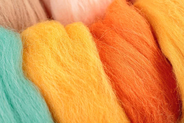 Skeins of wool, fibers, bright merino wool for crafts, selective focus