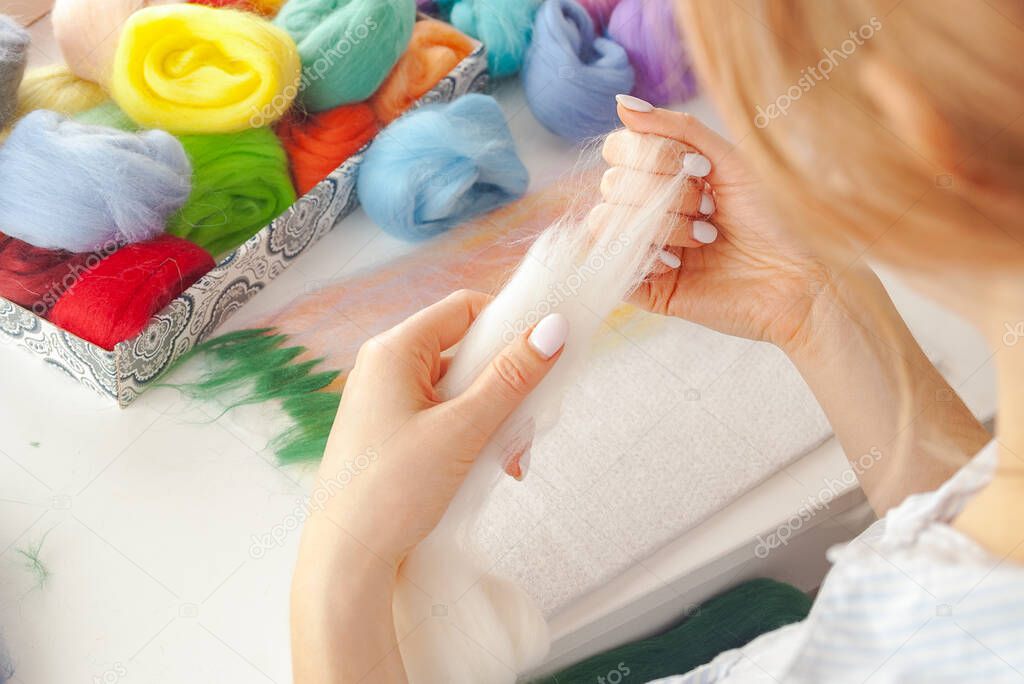 Hobbies and recreation wool felting multicolored, patterns and paintings, craft crafts and gifts, selective focus