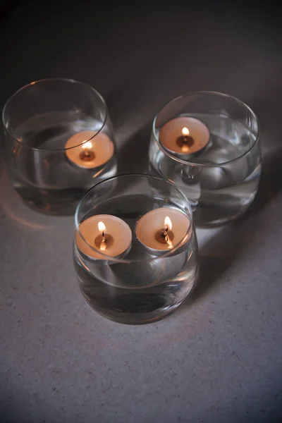 Lit Candles Water Candlesticks — Stock Photo, Image