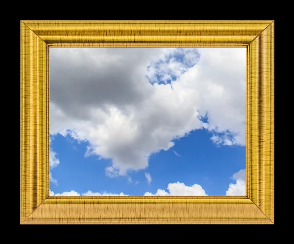 Nubes en el cielo azul sobre marco dorado — Foto de Stock