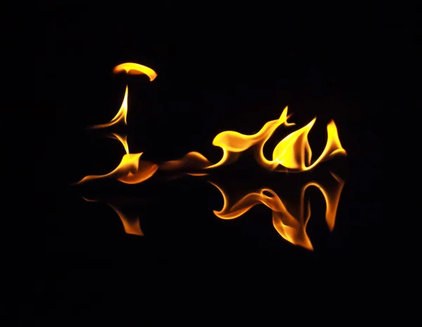 Fire flames on a black background — Stock Photo, Image